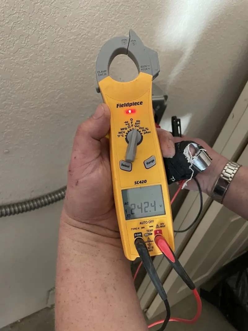 Voltage testing with clamp meter during Whole House Surge Protector in Fort Gibson